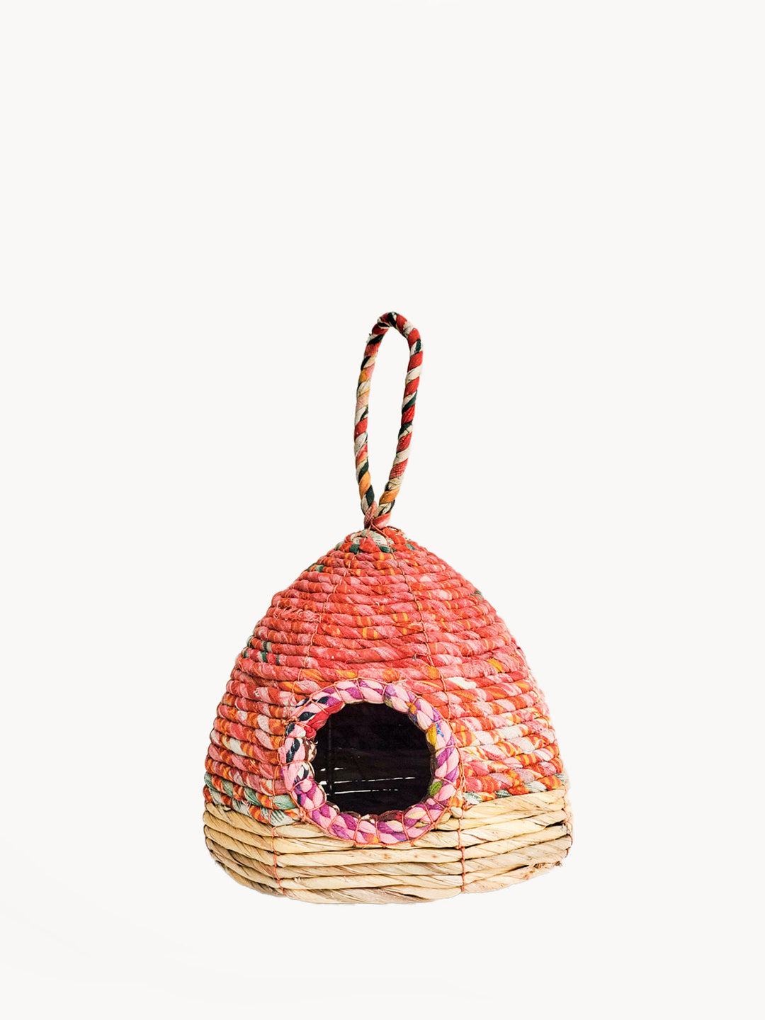 Coral beehive birdhouse coiled from recycled sari fabric with seagrass base band