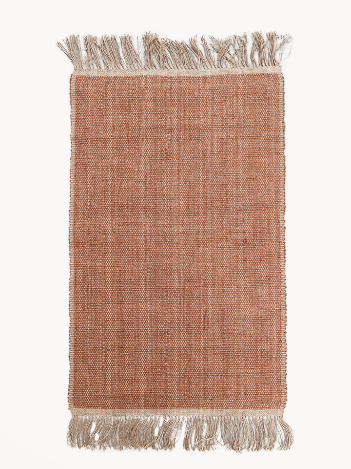 Brown braided jute area rug with rich natural-fiber tones
