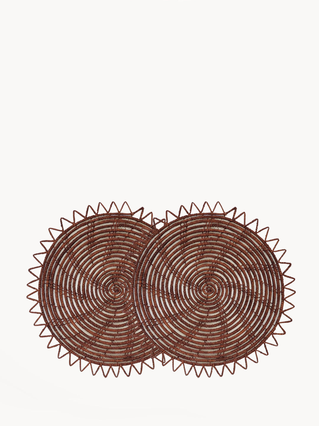 Round woven palm fiber placemats in brown, set of two