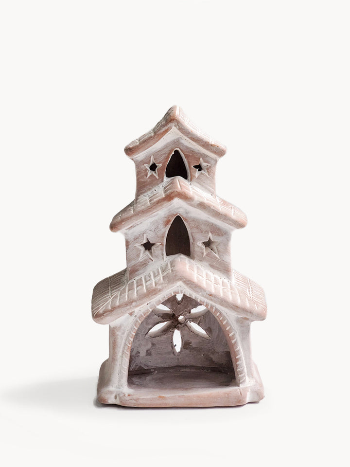 Terracotta house-shaped tea light lantern with cutwork in a natural finish