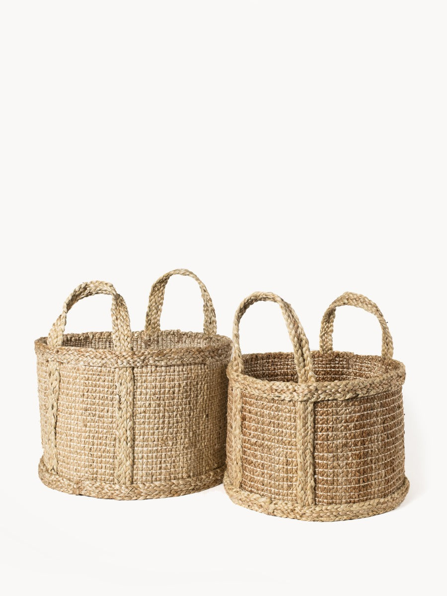 Natural jute basket from DC-KORISSA featuring woven texture and sturdy handles, ideal for storage or home decor.