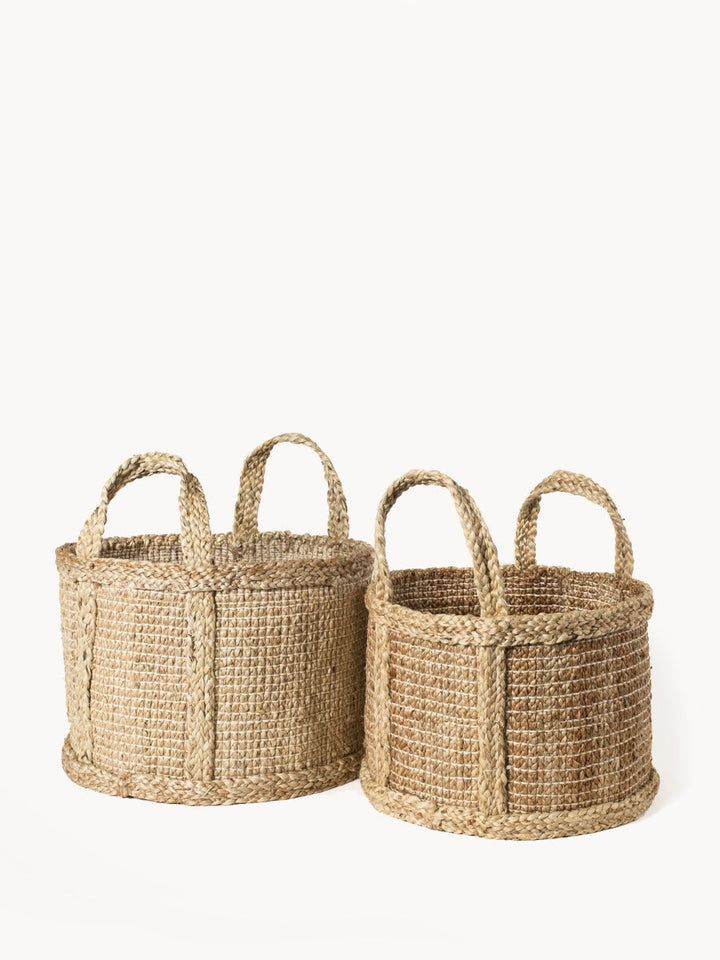 Natural jute basket from DC-KORISSA featuring woven texture and sturdy handles, ideal for storage or home decor.