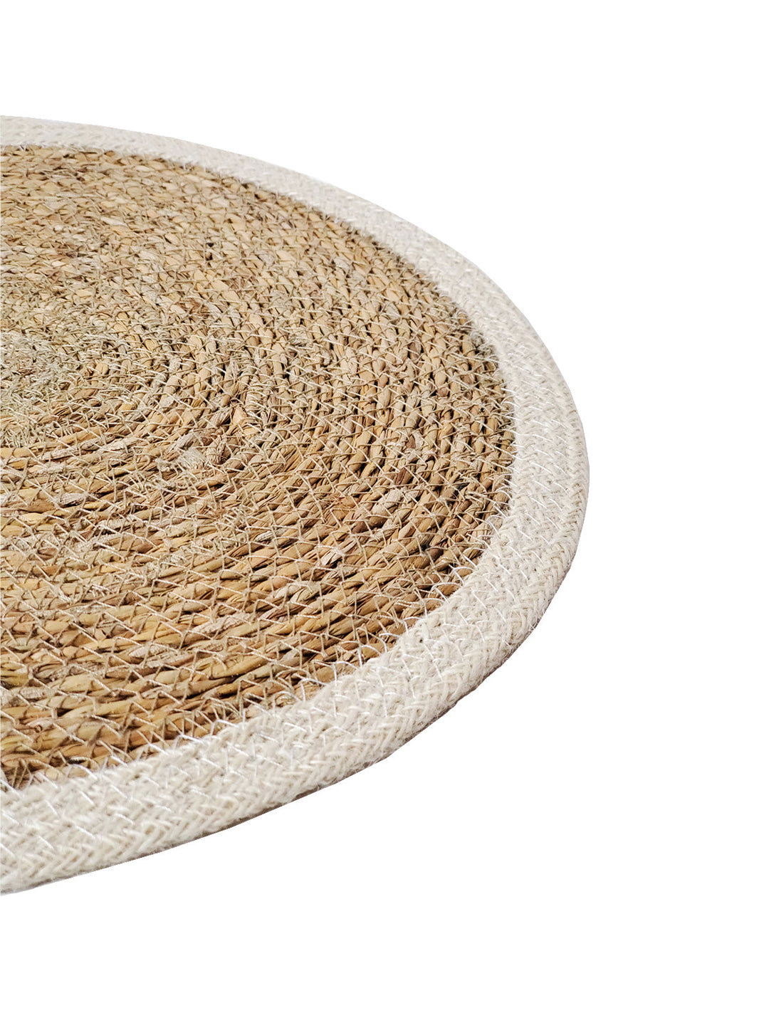 Handwoven seagrass placemat set from DC-KORISSA, showing natural textured placemats on a dining table.