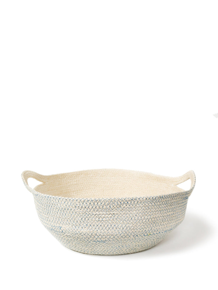 Handwoven jute fruit bowl in off-white with blue zigzag stitch and looped carry handles