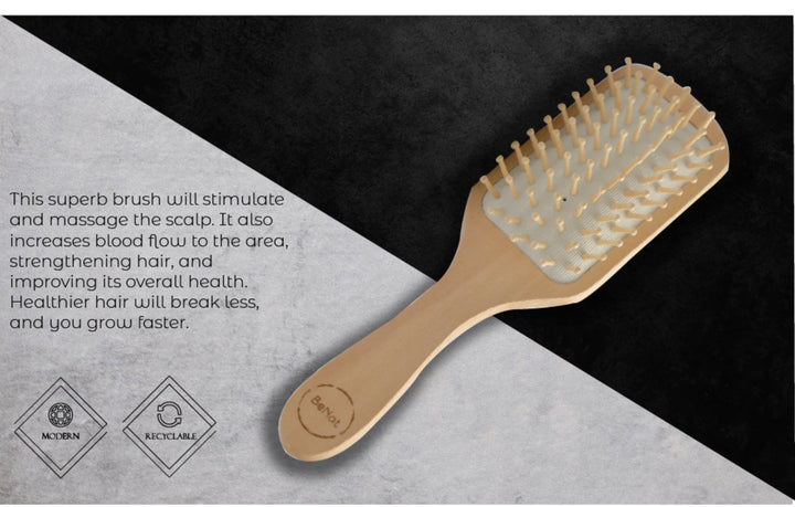 Bamboo detangling hair brush with a natural wooden handle and bristles, designed for gentle hair detangling.