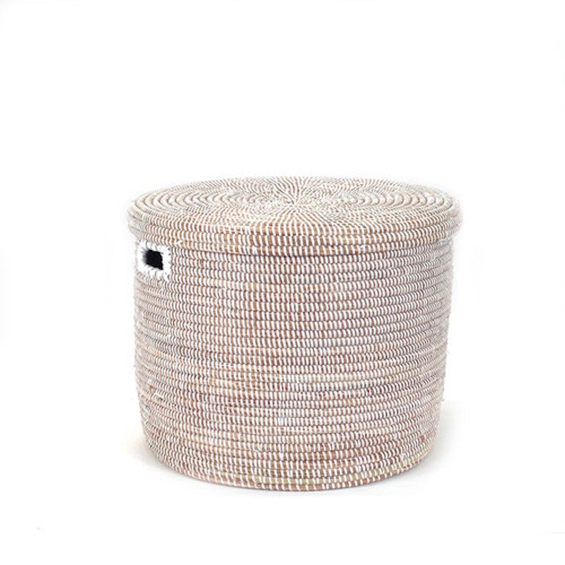 Handwoven white lidded floor storage basket with a sturdy structure.