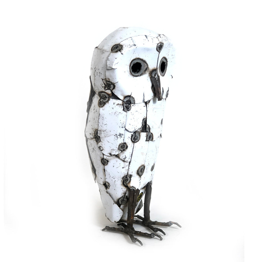 Recycled metal snowy owl sculpture with hand-detailed metal feathers.