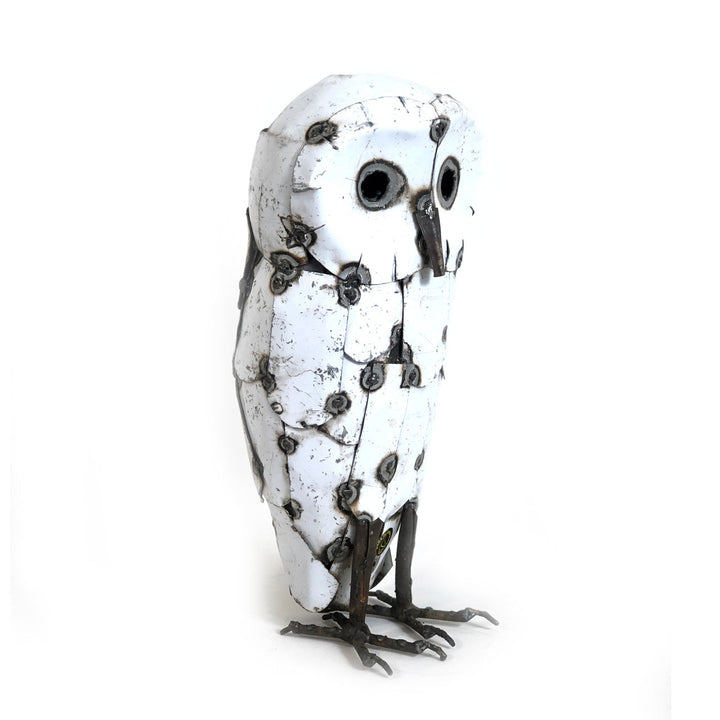 Recycled metal snowy owl sculpture with hand-detailed metal feathers.