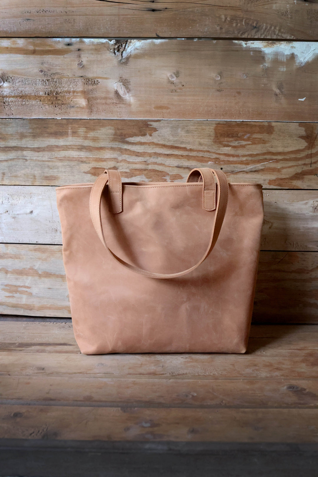 Large full-grain leather tote for work and everyday carry, with long shoulder straps.