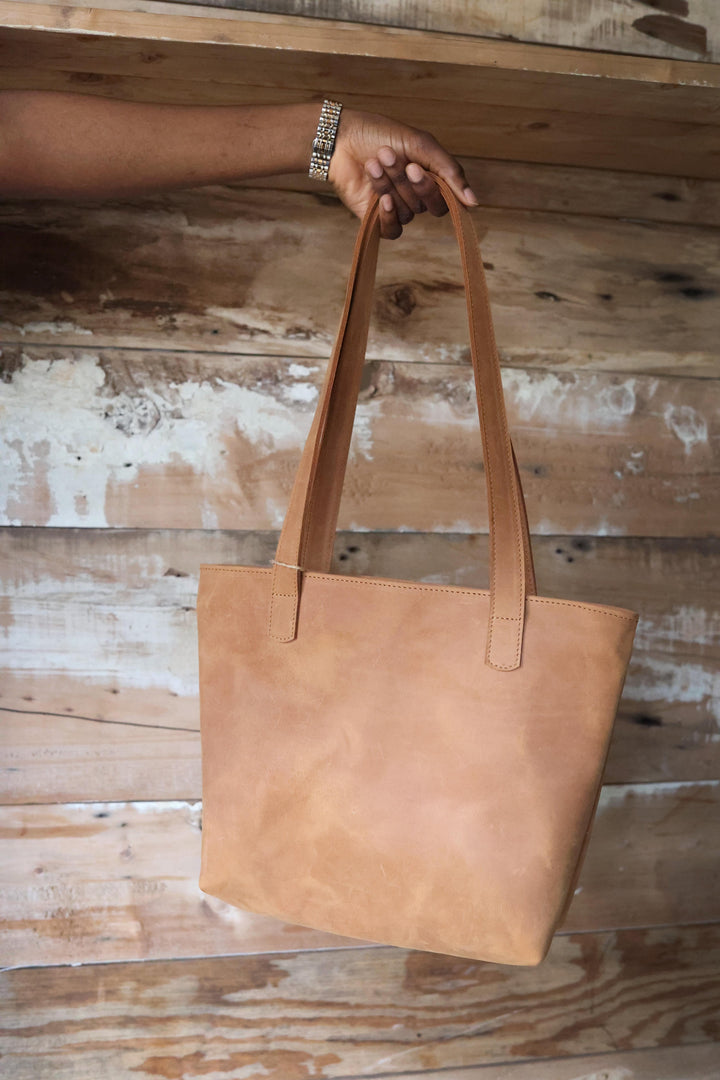 Small leather tote handmade in Nairobi, Kenya, with a roomy interior.