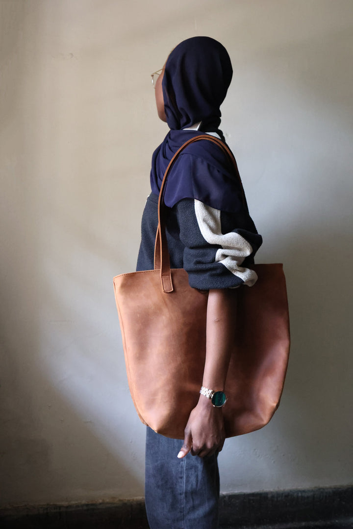 Large full-grain leather tote with sturdy top handles.