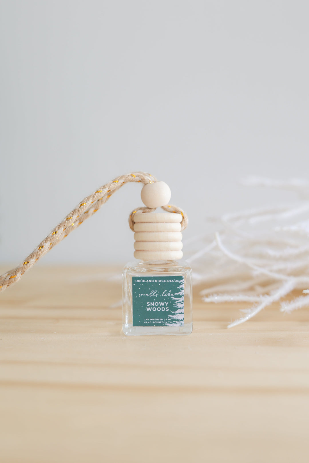 Snowy Woods car diffuser with a winter woodland design.