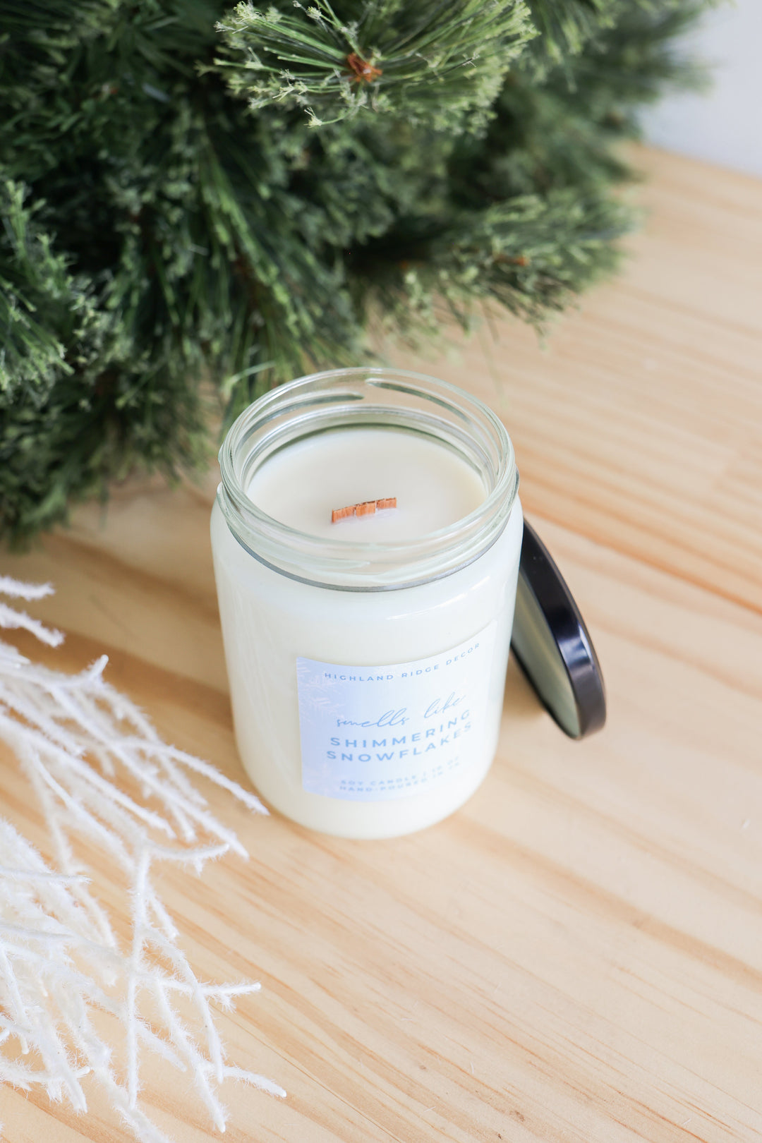 Shimmering Snowflakes soy candle with a festive winter design.