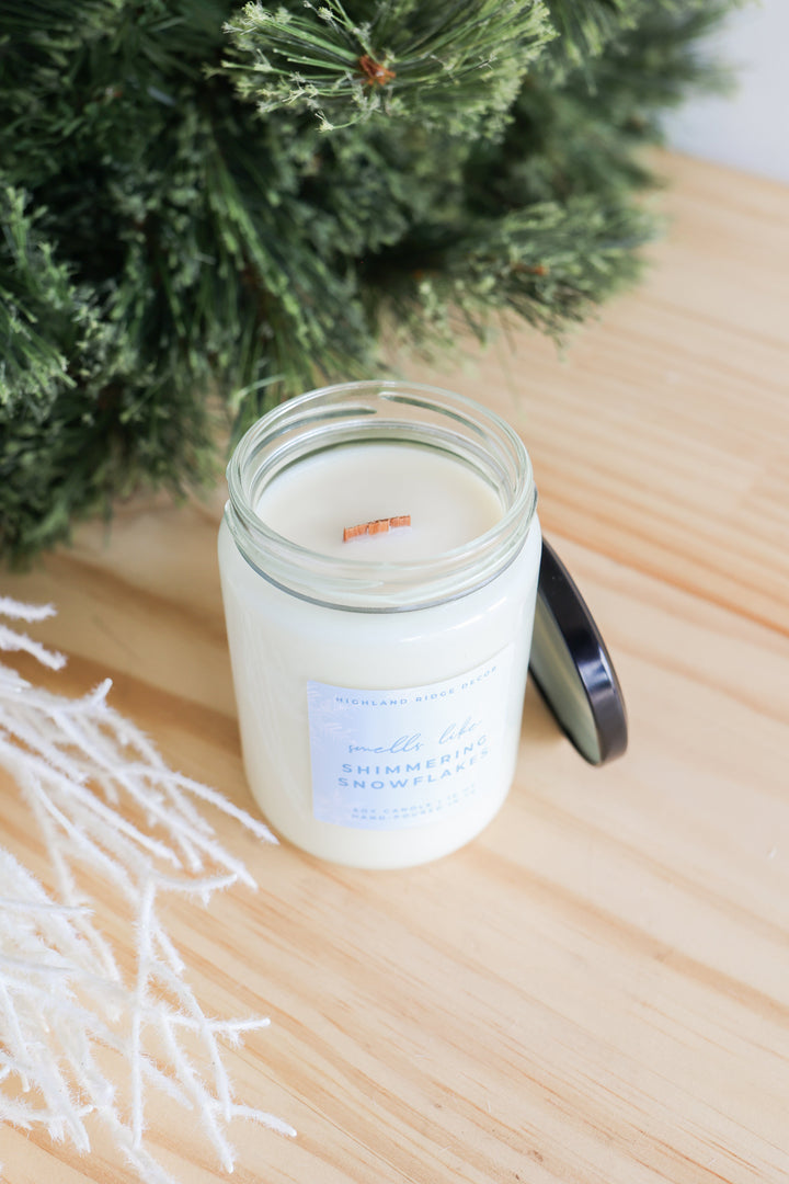 Shimmering Snowflakes soy candle with a festive winter design.