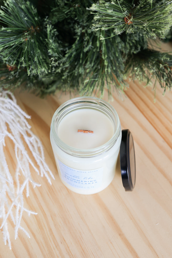 Shimmering Snowflakes soy candle with a winter snowflake design.