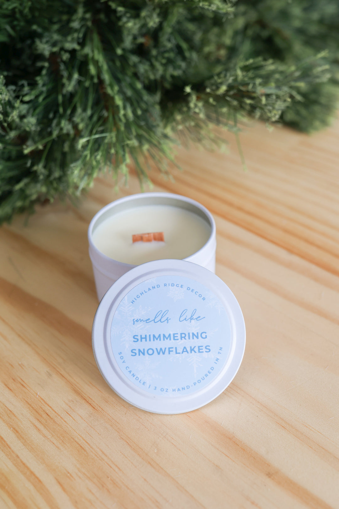 Hand-poured soy Shimmering Snowflakes candle, winter theme.