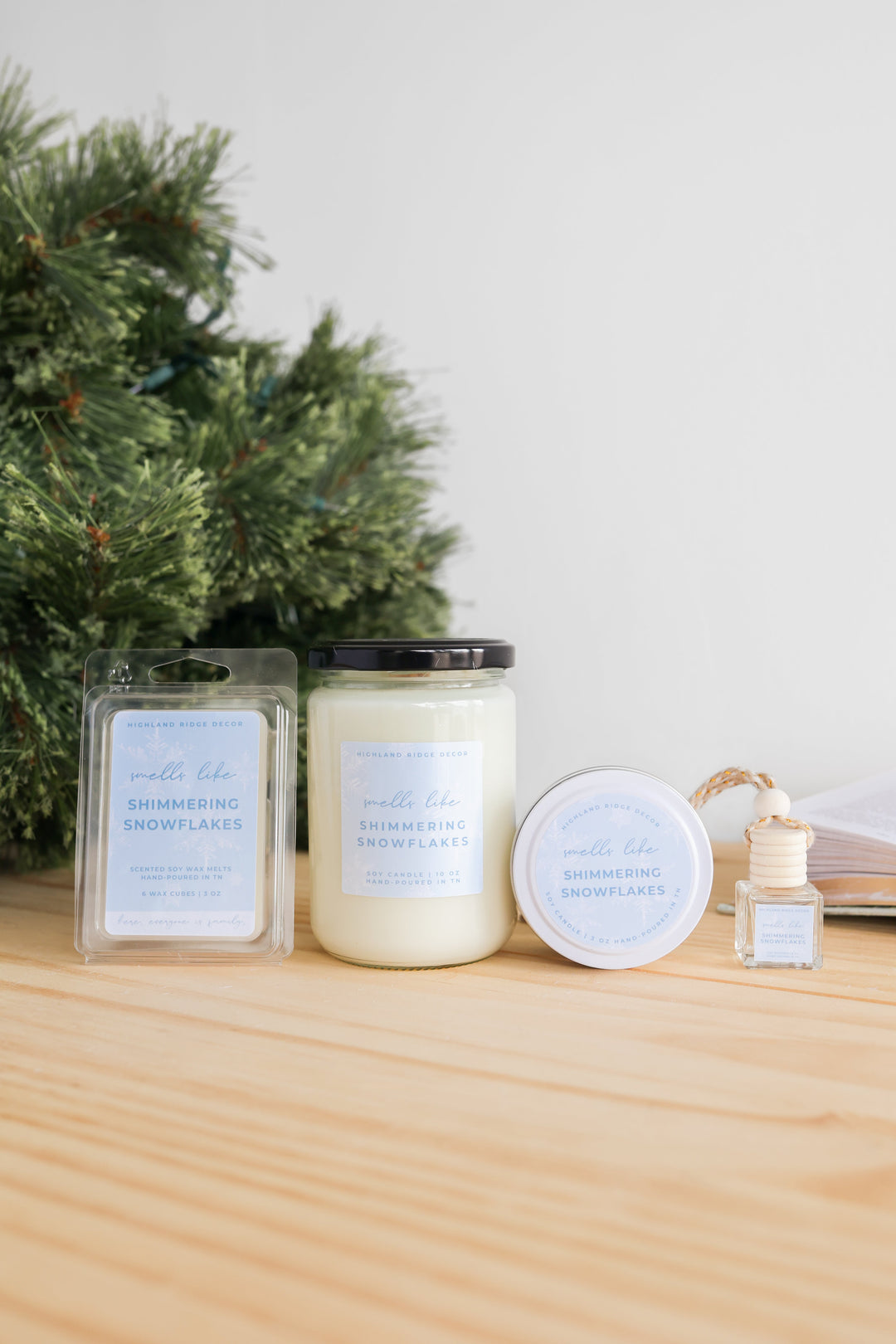 Shimmering Snowflakes soy candle with a glittering snowflake design.