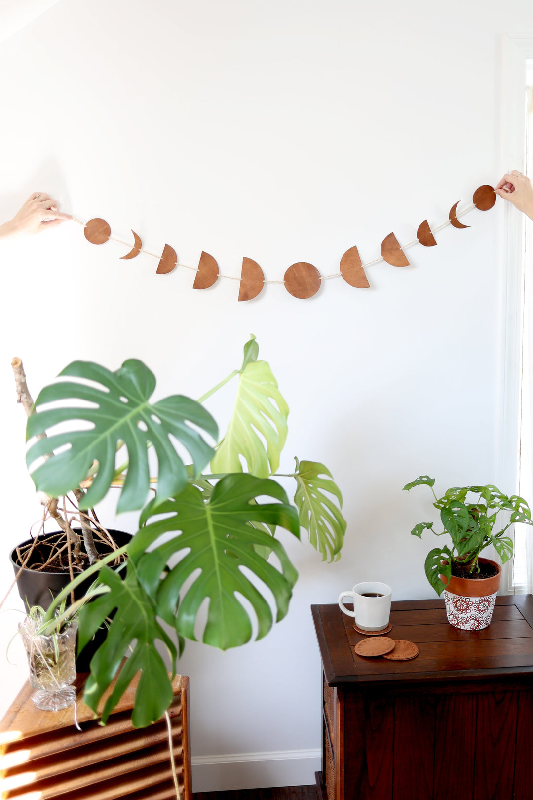 Leather Luna moon-phase garland for bedroom or living-room wall decor.