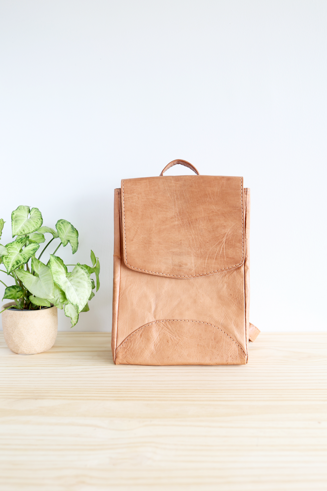 Small leather backpack for everyday carry, in natural Moroccan leather.