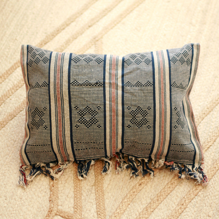 Handwoven Sumba ikat pillow cover featuring vibrant traditional textile patterns and soft texture.