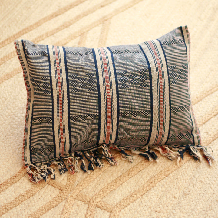 Handwoven Sumba ikat pillow cover featuring vibrant, intricate traditional decorative fabric with geometric patterns.
