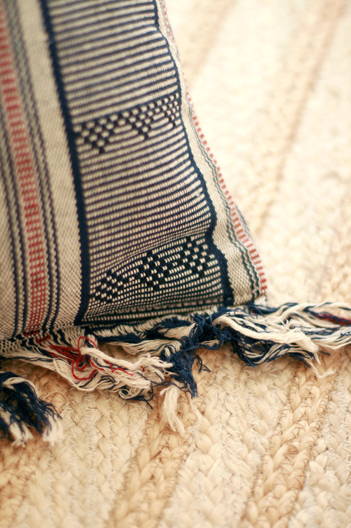 Handwoven Sumba ikat pillow cover featuring intricate traditional ikat patterns in vibrant colors.