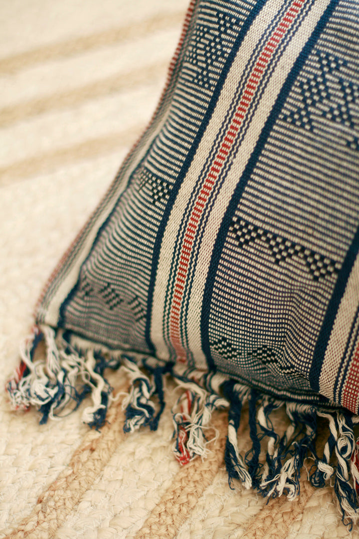 Handwoven Sumba ikat decorative pillow cover featuring vibrant traditional woven patterns.