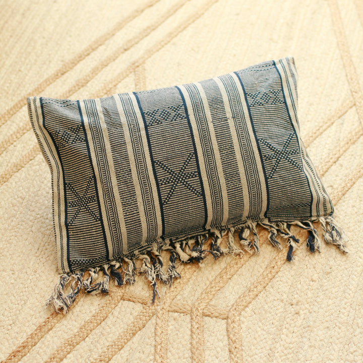 Blue striped ikat handwoven pillow featuring traditional Sumba textile design.
