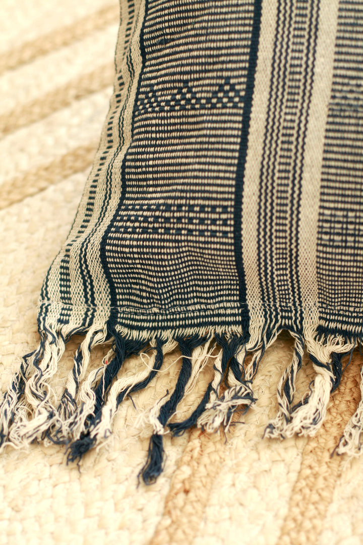Blue striped ikat handwoven pillow with intricate woven patterns and soft fabric, perfect for decorative cushions.