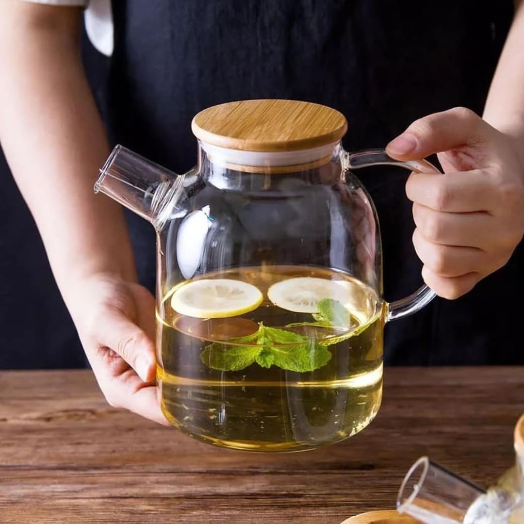 Large 54 oz borosilicate glass teapot with a clear glass body and lid, for brewing and serving tea.