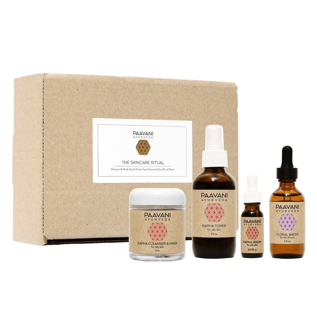 Kapha Ayurvedic skincare ritual with herbal oils and skincare items.