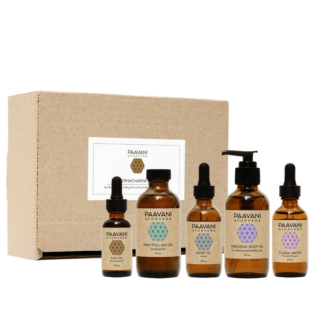 Dinacharya Ayurvedic self-care kit with oils for daily use.