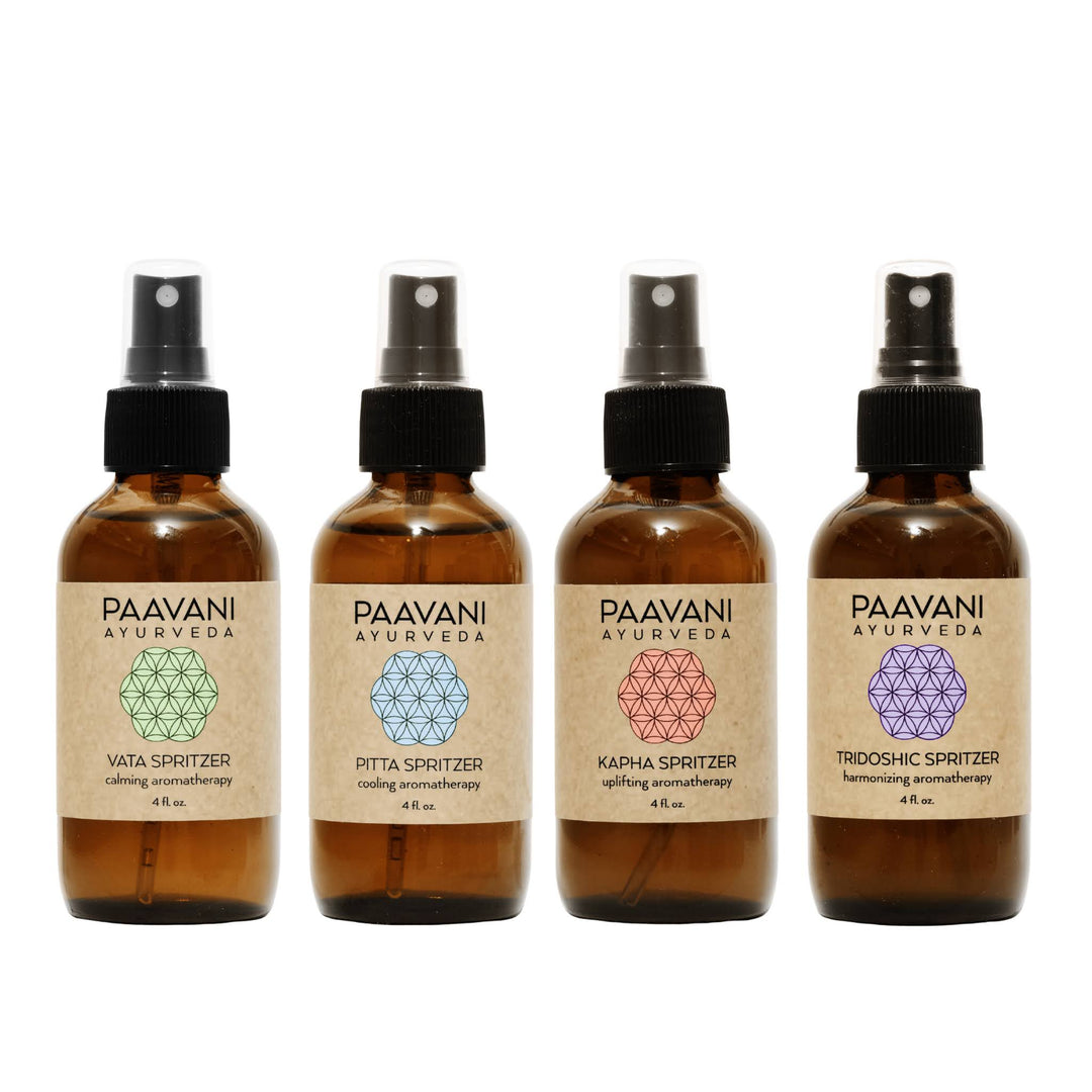 Ayurvedic aromatherapy ritual kit with essential oil spritzers and accessories.