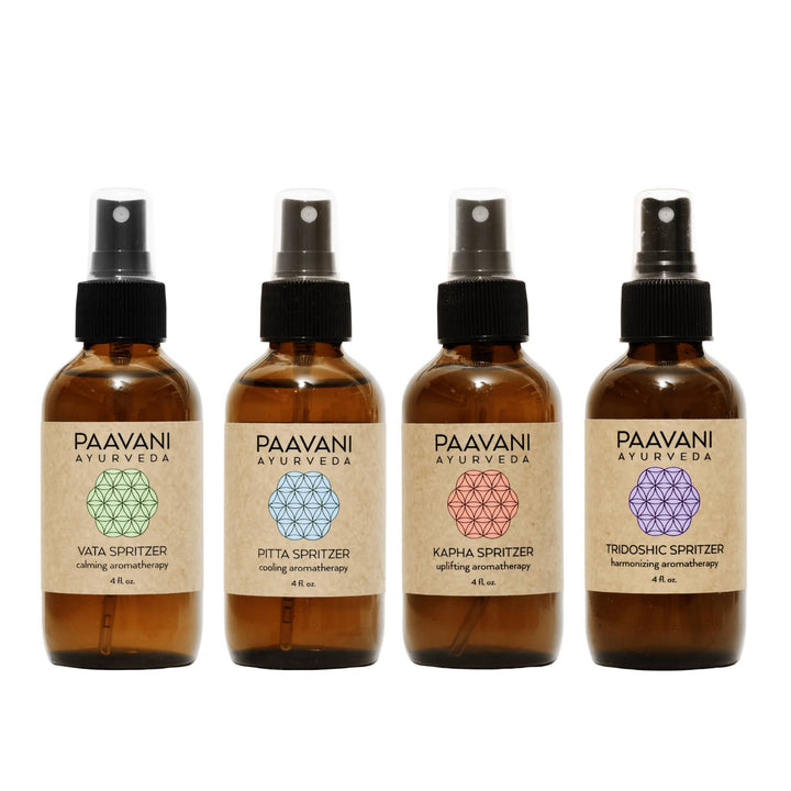 Ayurvedic aromatherapy ritual kit with essential oil spritzers and accessories.