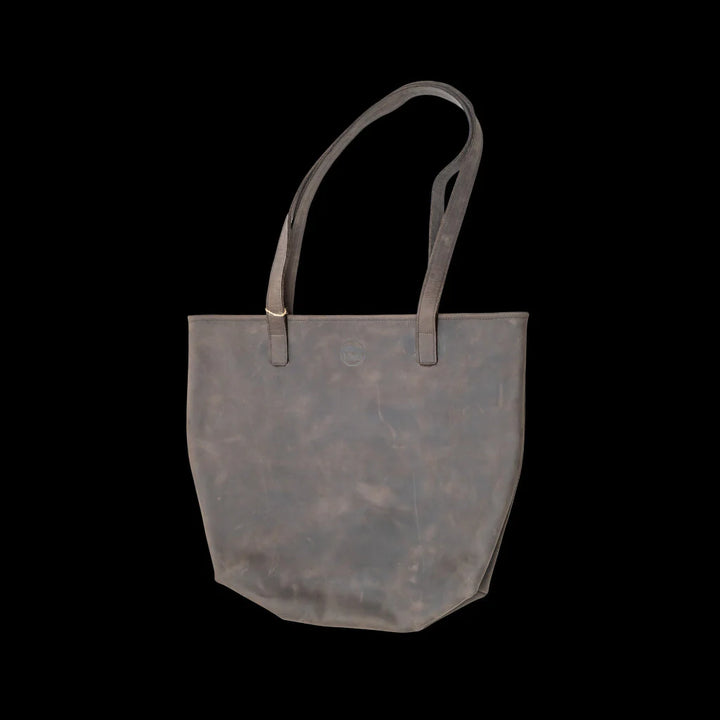 Large full-grain leather tote bag with a roomy interior and long straps.