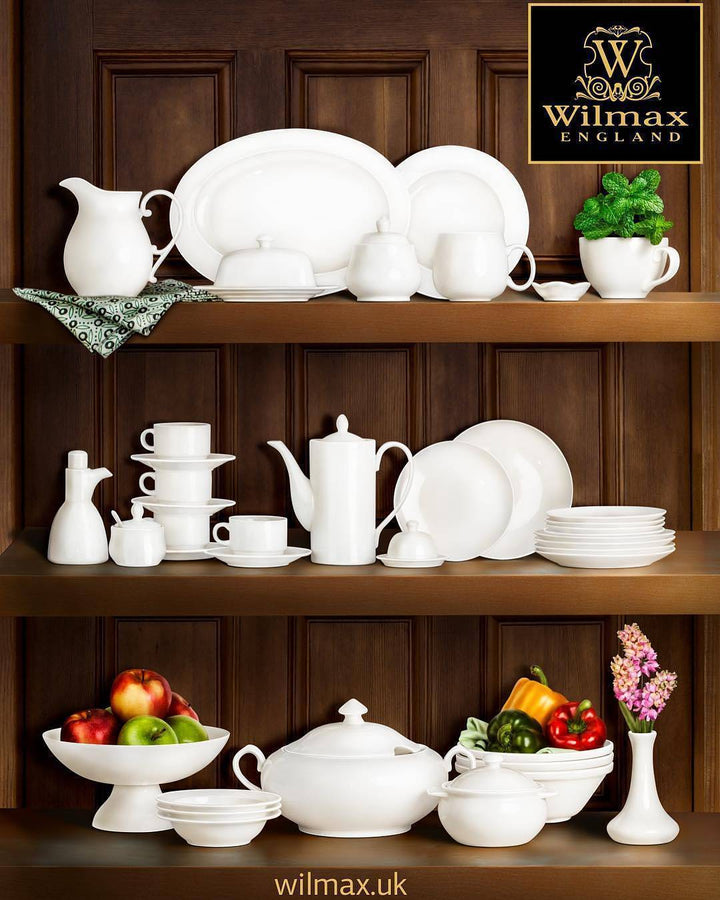 Porcelain divided sauce dish with three compartments, white with a rounded design.
