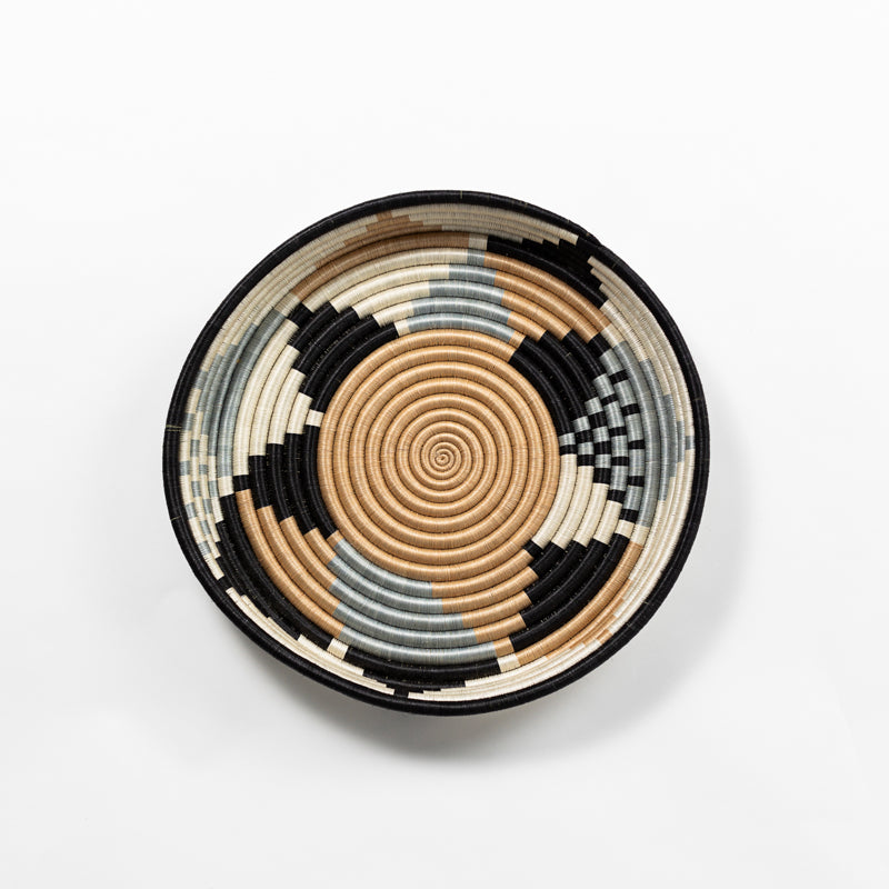Overhead view of a large Boutique Diversiform woven bowl in cool gray, slate-blue, camel, and cream.