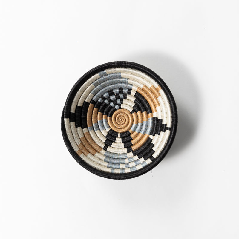 Overhead view of a small Boutique Diversiform woven bowl in gray and slate-blue.