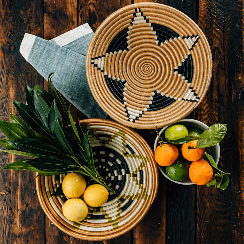Boutique Vestine green woven bowls with an intricate star pattern.