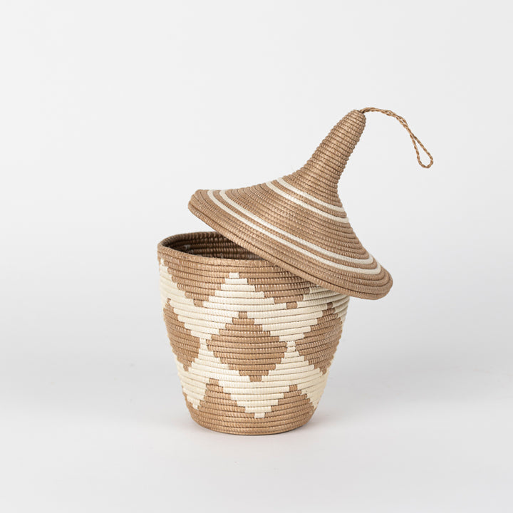 Sisal peace basket with a woven chevron-diamond pattern.