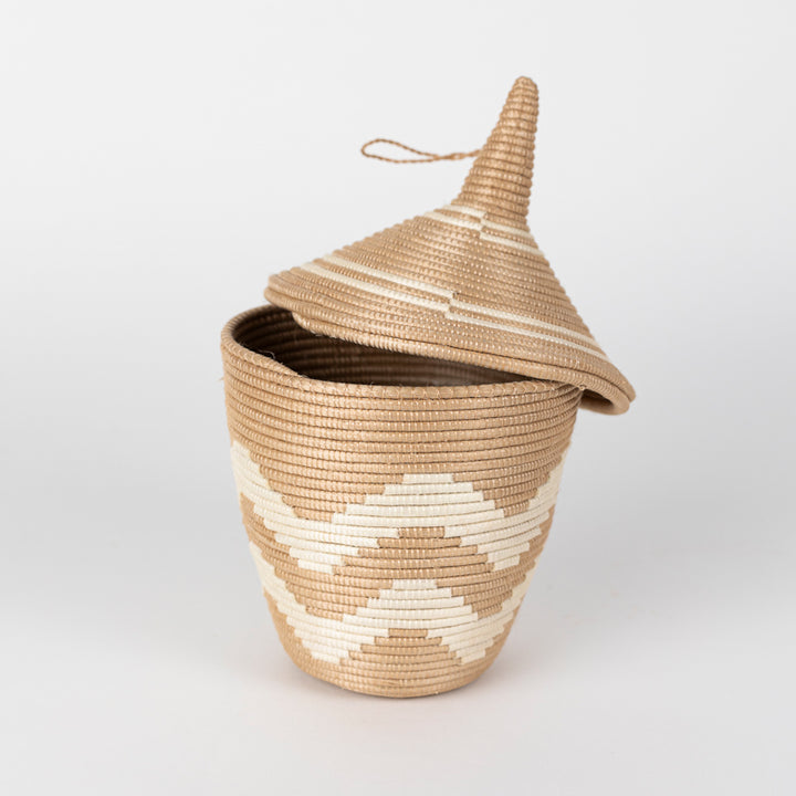 Chevron-patterned sisal peace basket in handwoven natural fiber.