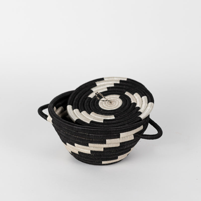 Medium woven storage pot with a lid in black and natural tones.