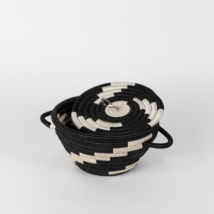 Medium woven storage pot with a lid in black and natural tones.