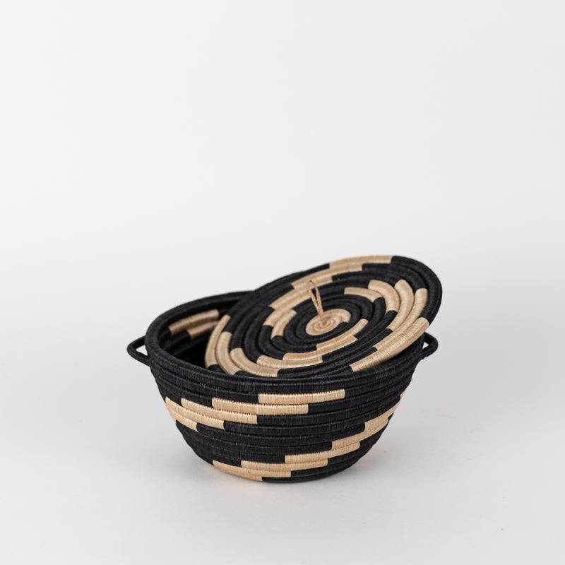 Medium woven storage pot with a tea-dyed lid and black woven exterior.