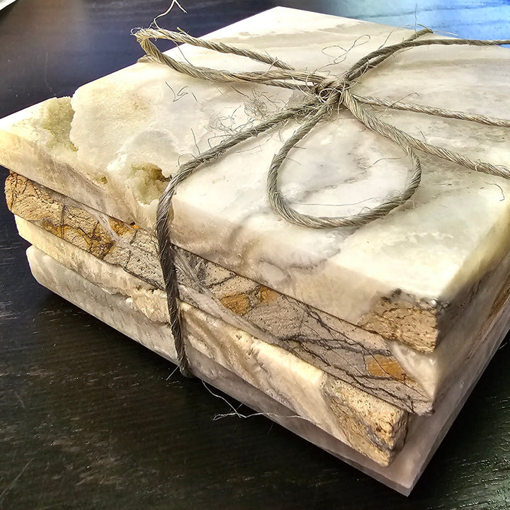 Hand-carved onyx coasters showing natural brown and dark banding.