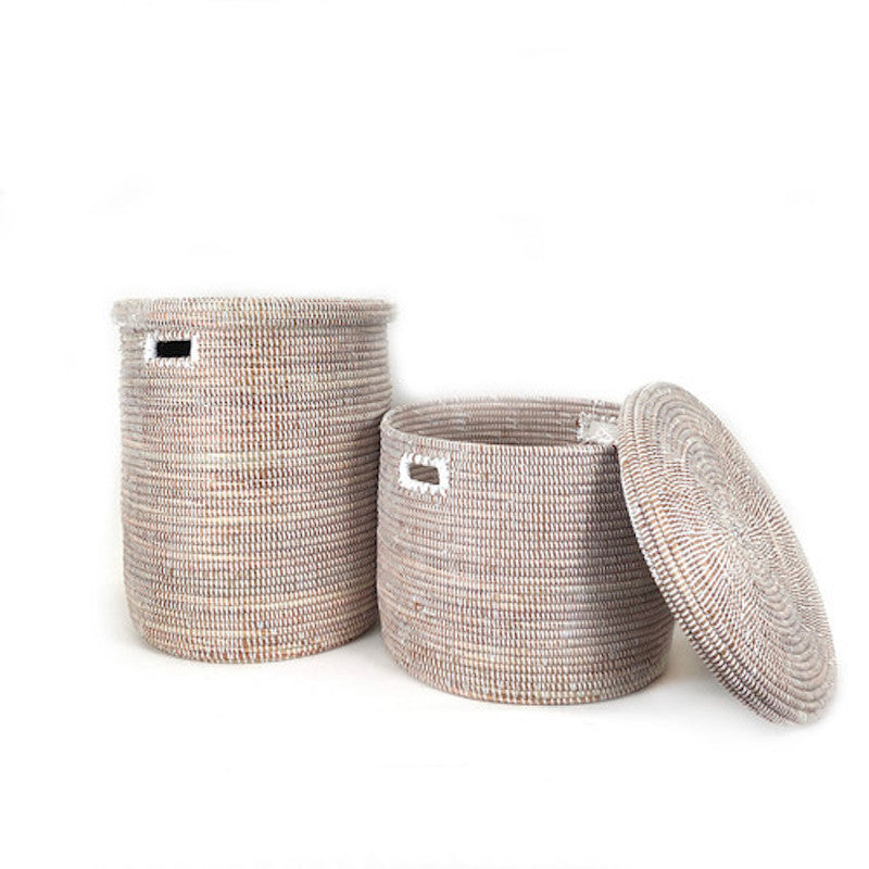 Handwoven white floor basket with a flat lid for hidden storage.