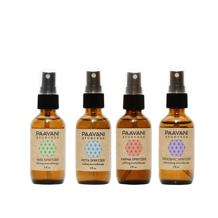 Ayurvedic aromatherapy ritual kit with essential oils and accessories.
