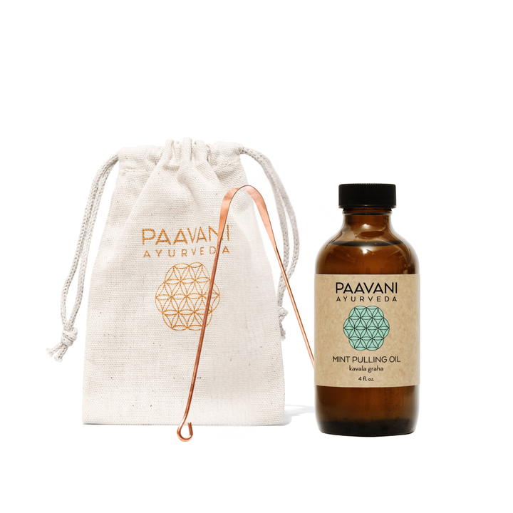 Ayurvedic oral care kit with a copper tongue scraper and herbal pulling oil in a complete set.