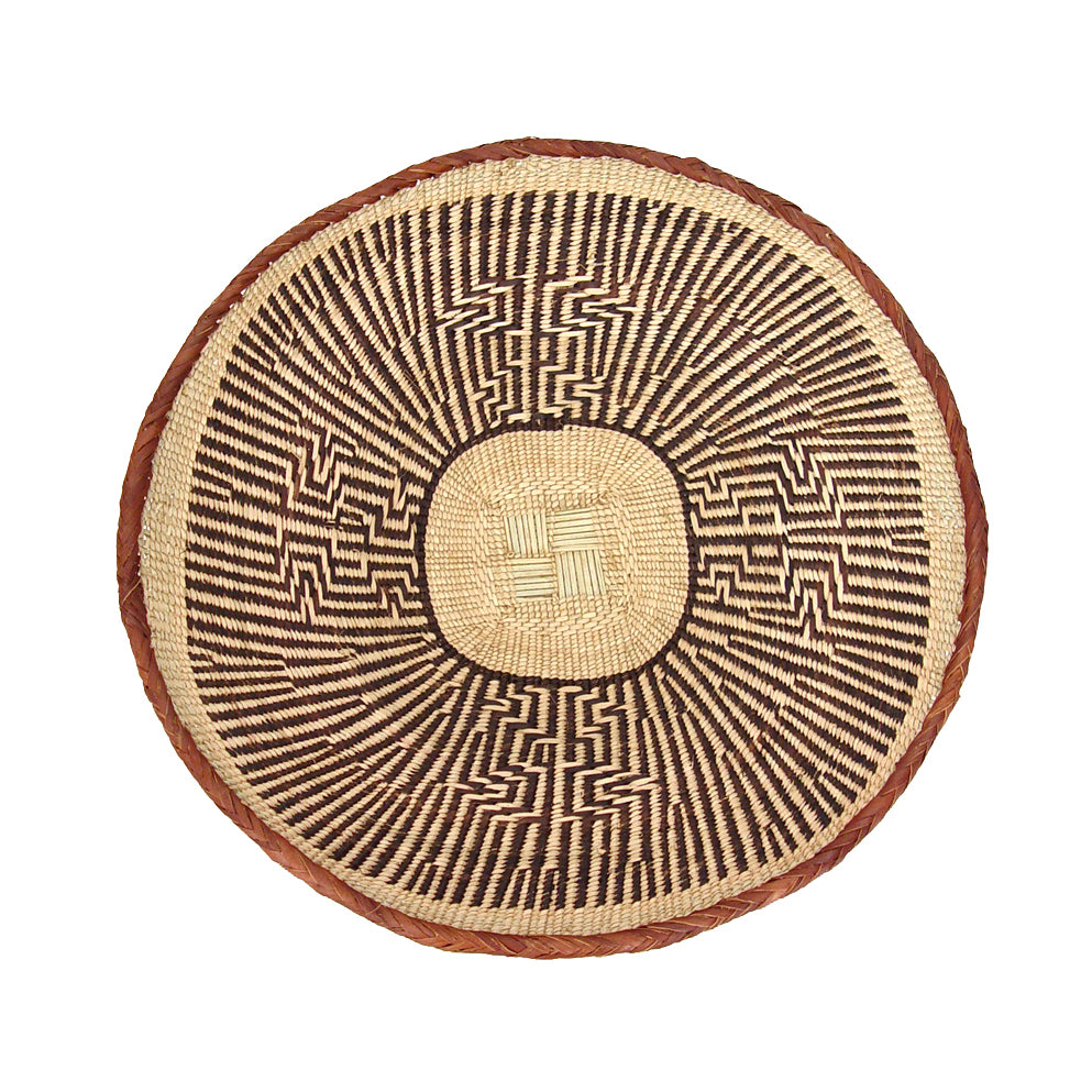 Set of five Tonga wall baskets, woven natural fiber for a gallery wall.