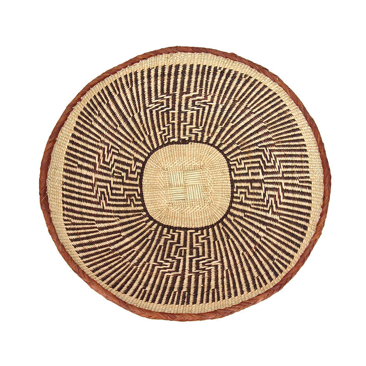 Set of five Tonga wall baskets, woven natural fiber for a gallery wall.